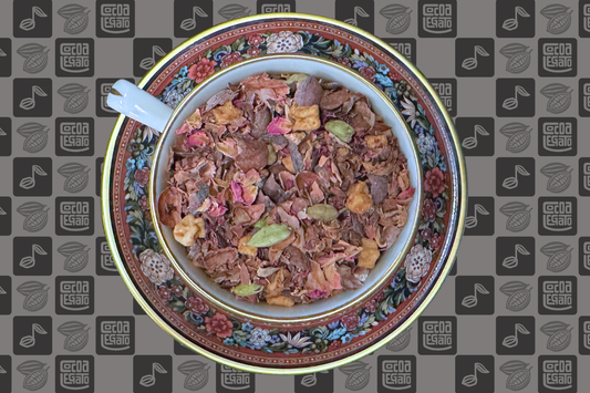 A teacup full of blended herbal tea on a Cocoa Legato logo background