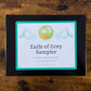 Closed box with label reading "Earls of Grey Sampler: 8 different bergamot teas, 3-5 servings of each