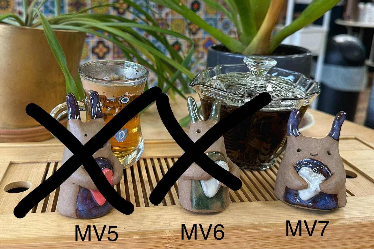 Four slug-type tea pets with hearts numbered MV5-MV7