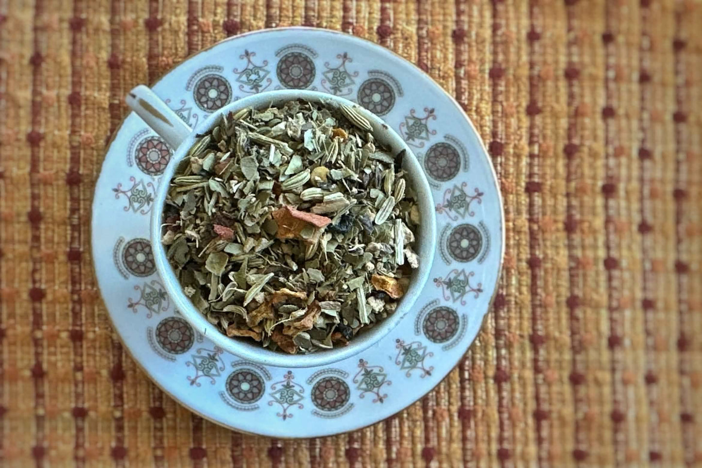 Teacup full of yerba mate with pumpkin and spices