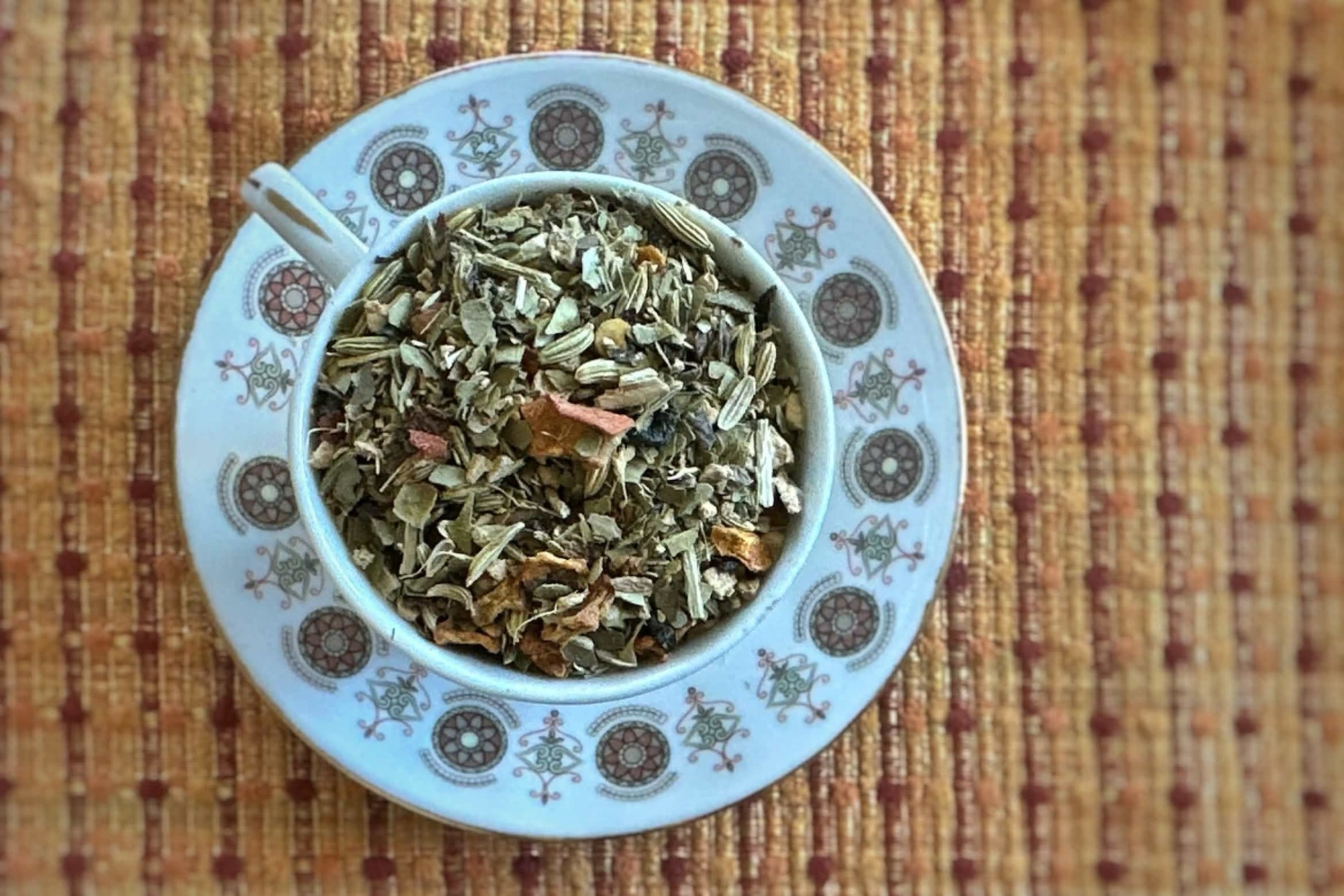 Teacup full of yerba mate with pumpkin and spices