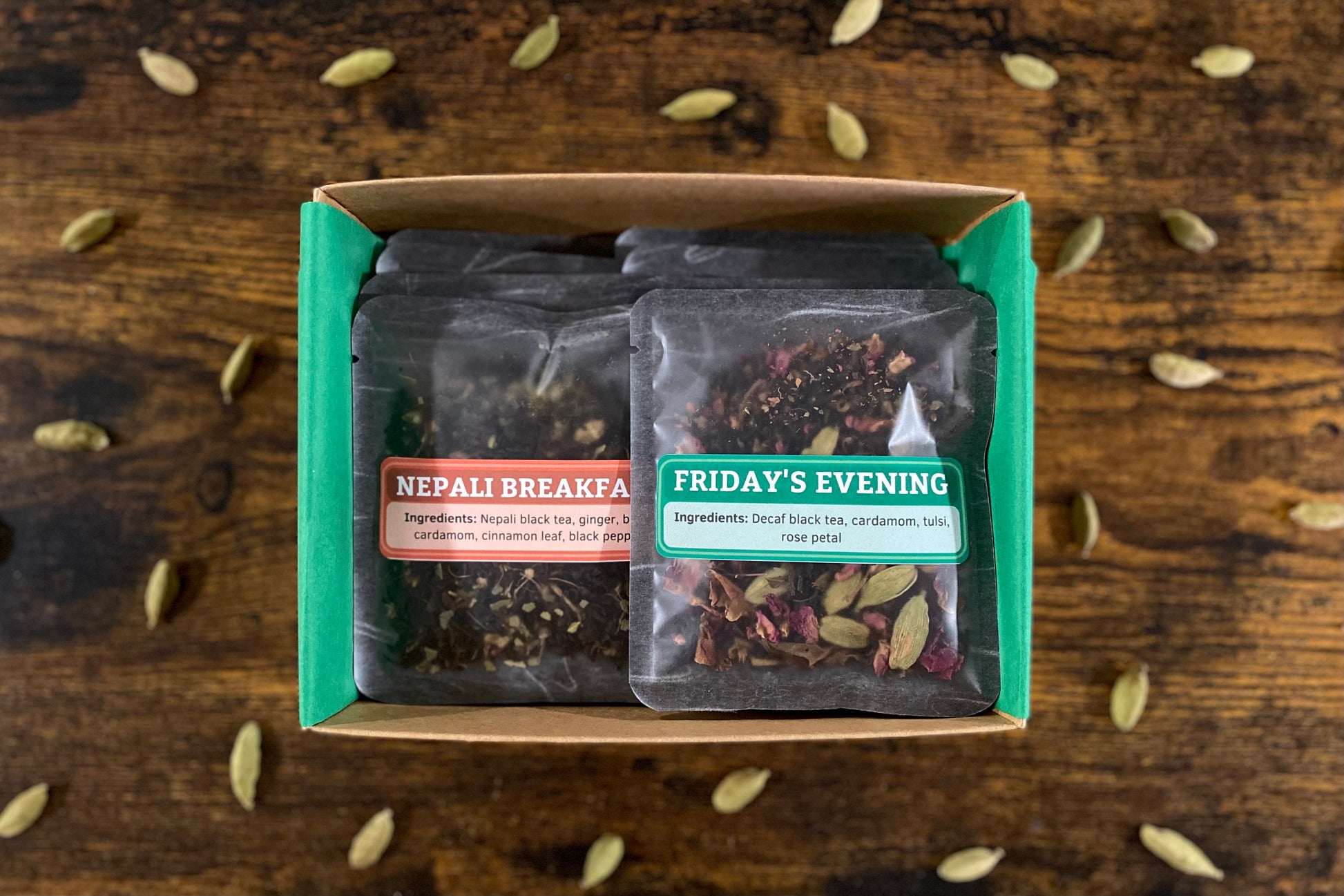 box of chai samples with two showing labeled "Nepali Breakfast" and "Friday's Evening"