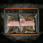 Open orange sampler box on black background with two teas showing: Nevermore & Wolfman