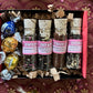 Open box of Love Potions, showing four glass vials of tea and three Lindt chocolate truffles